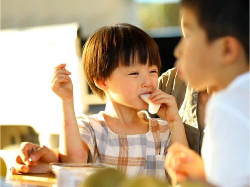 A child eating a pear